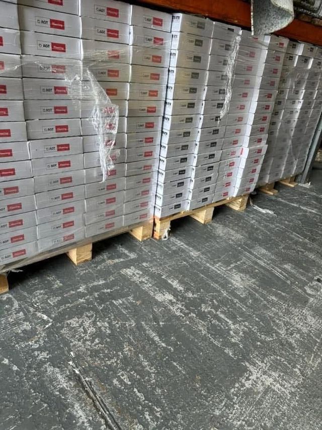 Pallets of boxed laminate flooring in stock at the FloorTradeDirect warehouse, Doncaster