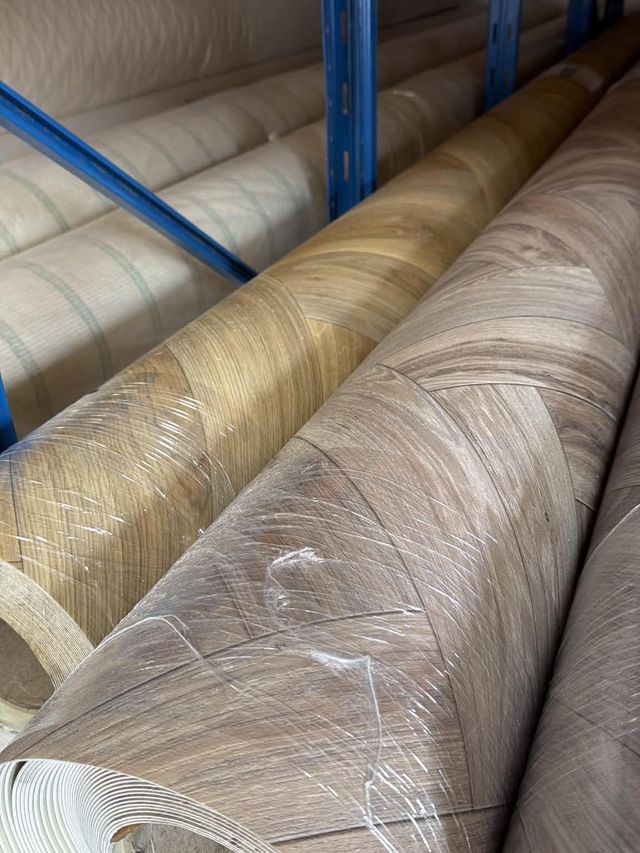 Rolls of vinyl flooring on racking at the FloorTradeDirect warehouse, Doncaster