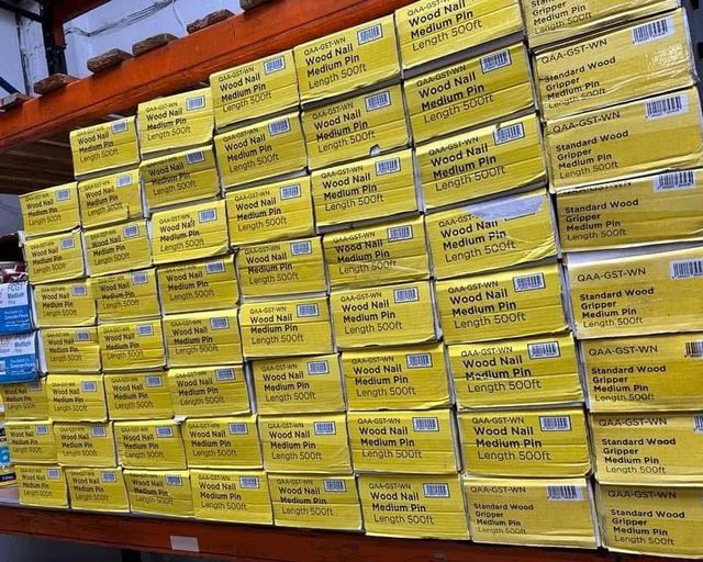 Shelves stacked with boxes of wood gripper at the FloorTradeDirect warehouse, Doncaster